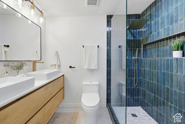 Dual vessel sinks with gold-finish faucets