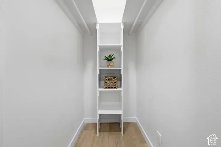 Built-in shelving unit with wood-finish flooring