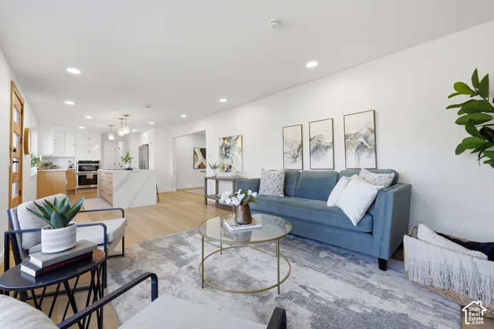 Open-concept interior with light wood-finish flooring