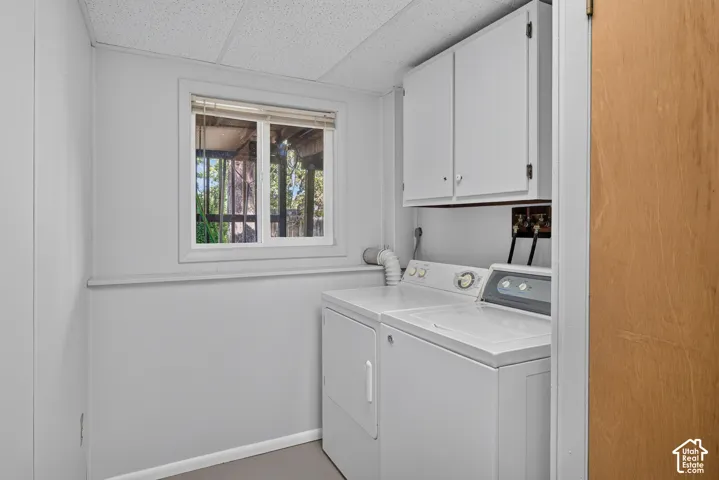 White upper cabinetry with contrasting hardware