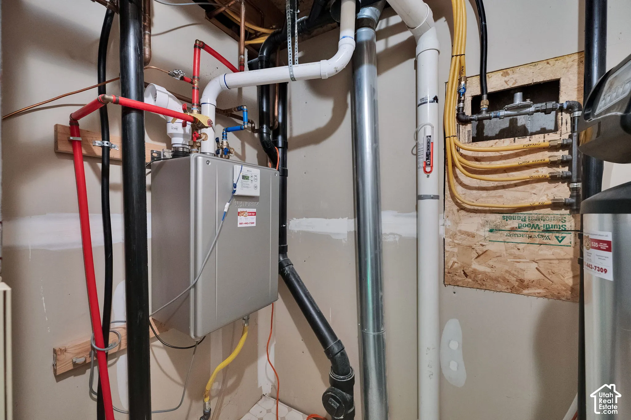Tankless water heater system, radon mitigation system
