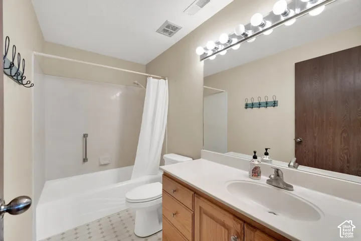 White vanity countertop with an integrated sink and chrome faucet