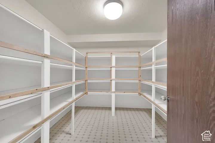 Large storage room with built in shelving