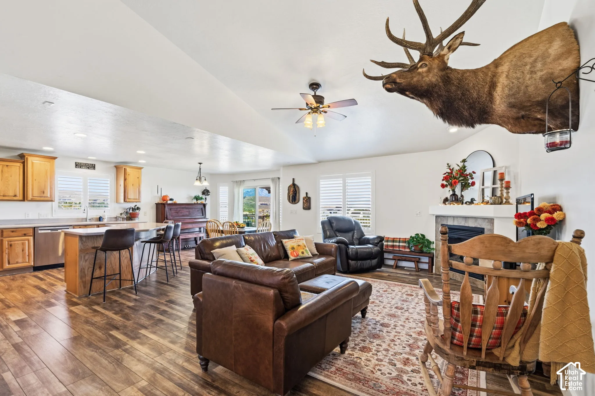 Wood-finish flooring throughout, vaulted ceiling, and recessed lighting