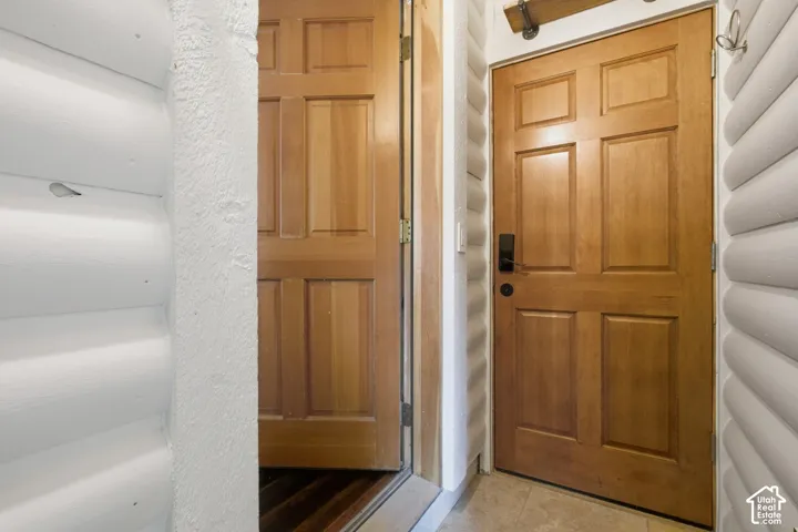 Paneled wood doors with black hardware