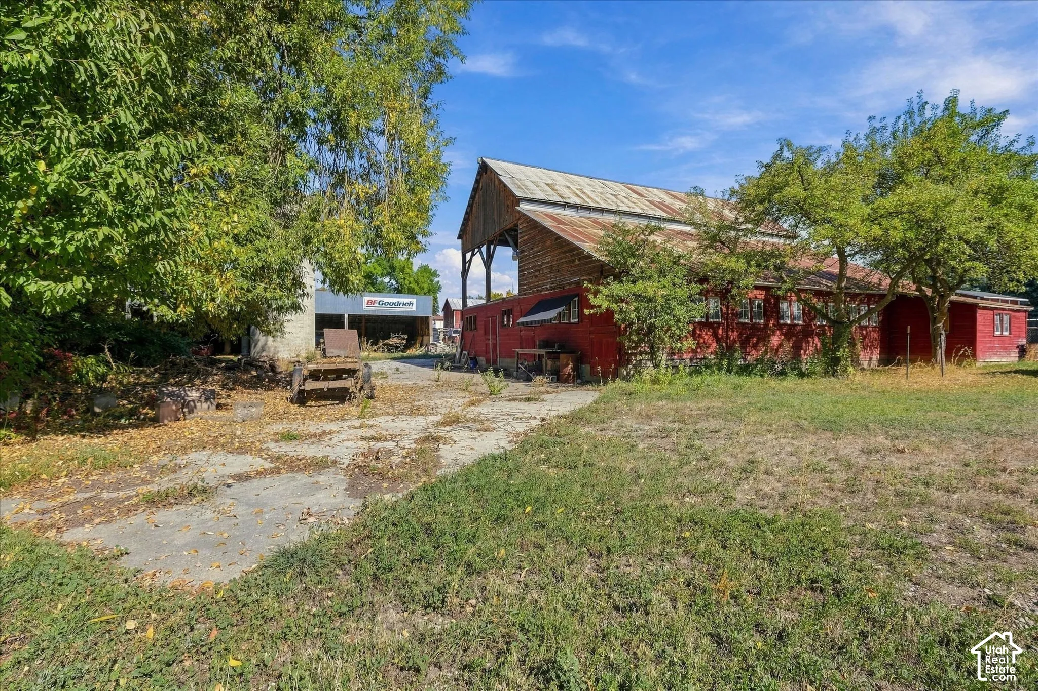 Red-painted barn structure with a metal roof