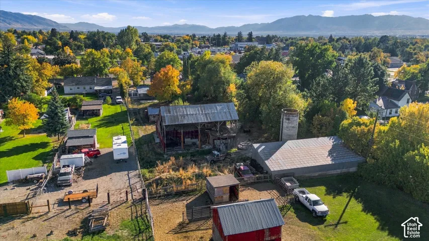 Expansive grounds featuring a red barn, additional outbuildings, and a silo