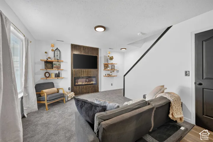 Accent wall with vertical wood paneling and integrated electric fireplace