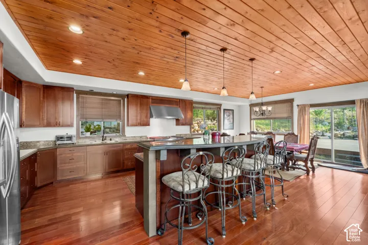 Wood-plank ceiling with recessed lighting