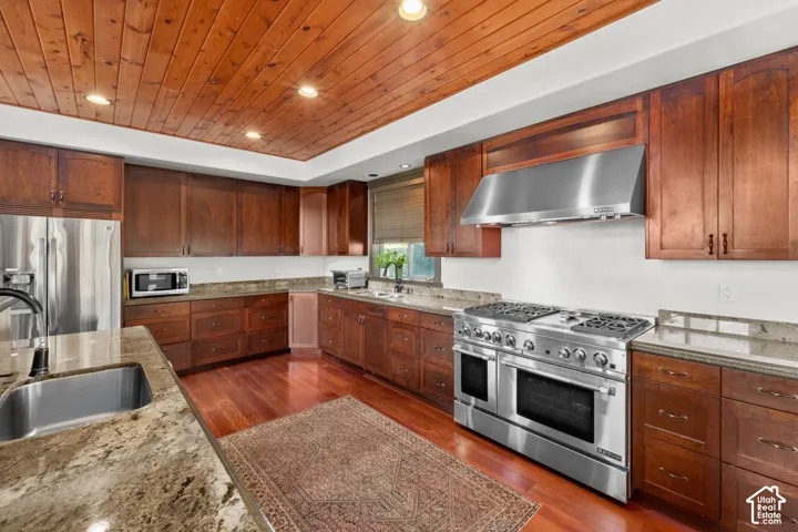 Wood-paneled ceiling with recessed lighting