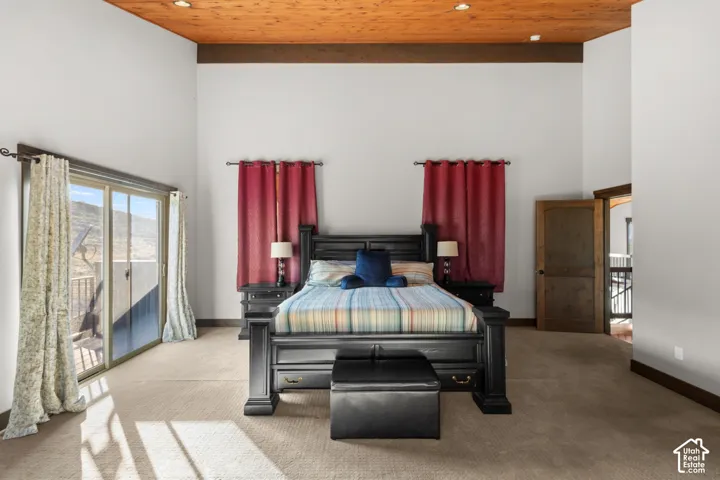 Vaulted wood-paneled ceiling with recessed lighting