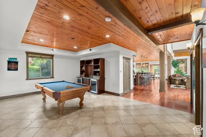 Wood plank ceiling with recessed lighting