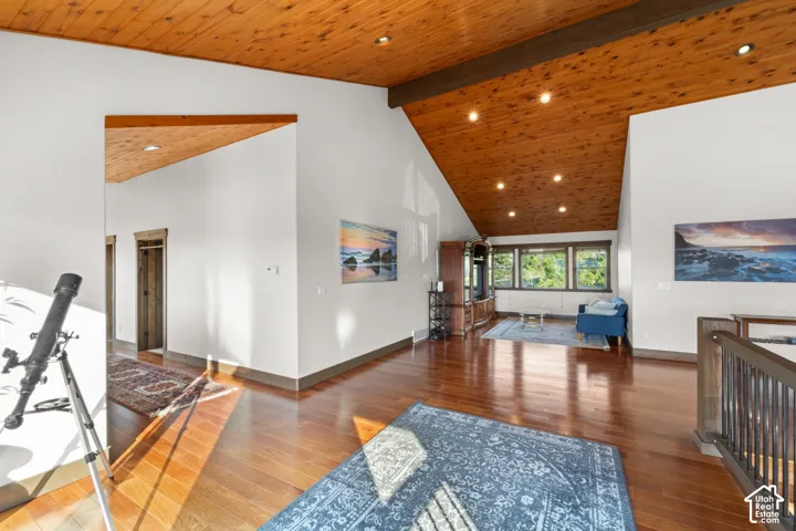 Vaulted wood-paneled ceiling with recessed lighting