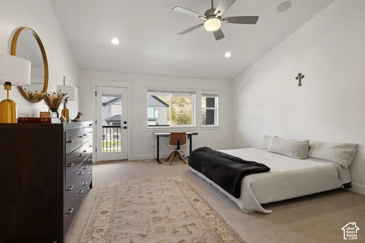Pitched ceiling featuring a ceiling fan, recessed lighting, and integrated ceiling speakers