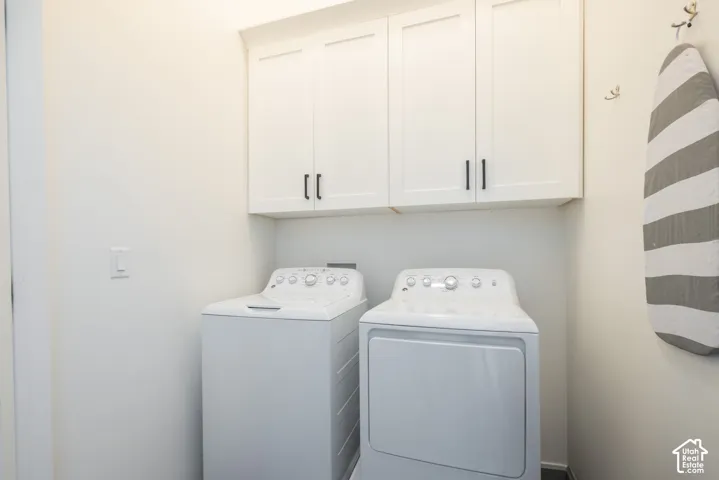White shaker-style cabinetry with matte black hardware