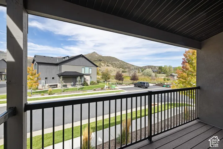 Private balcony with composite decking and black metal railings