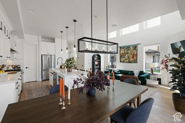 Open-concept living space with high ceilings and transom windows