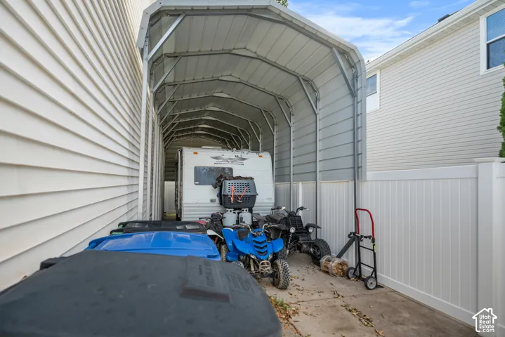 Carport structure providing sheltered parking or storage
