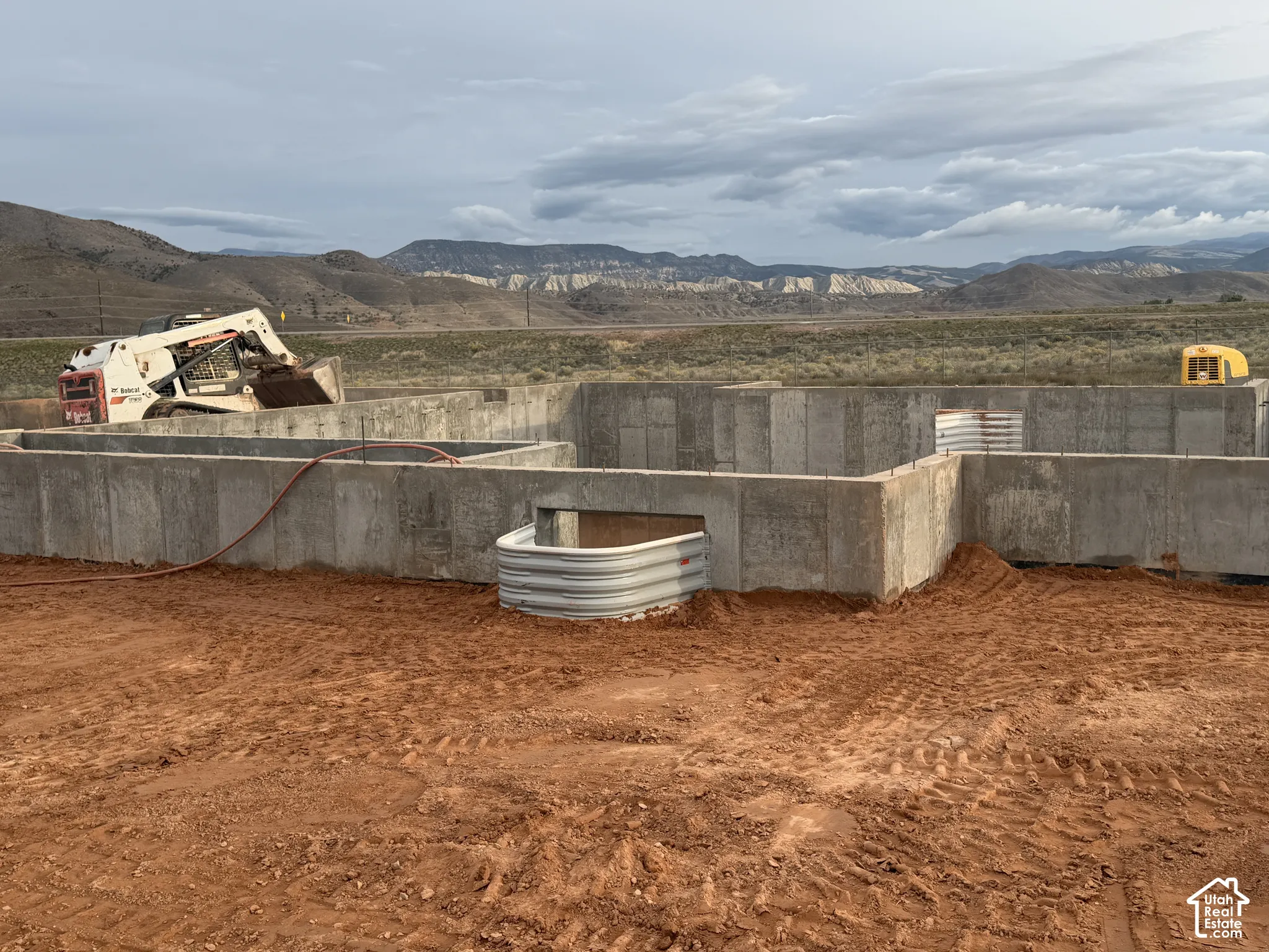 Poured concrete foundation walls with integrated window wells