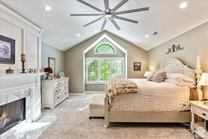 Vaulted ceiling featuring a multi-blade ceiling fan and recessed lighting