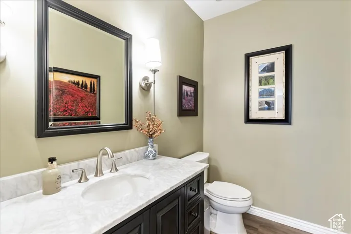 Vanity with a white countertop and undermount sink