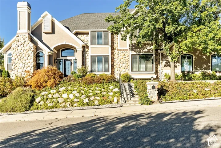 Stucco and stone exterior with architectural trim