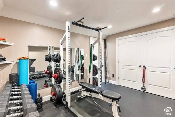 Recessed ceiling lighting illuminates a room with rubber flooring
