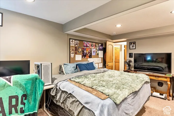 Recessed ceiling lighting, wood-finish interior door, and neutral wall paint