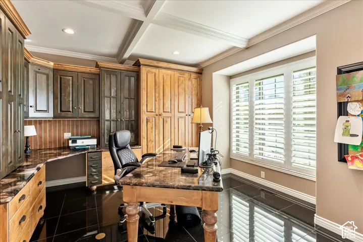 Built-in cabinetry, coffered ceiling, plantation shutters, recessed lighting, and polished black tile flooring