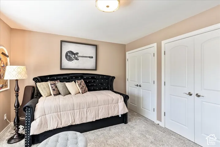 Neutral-toned walls complement plush carpeting