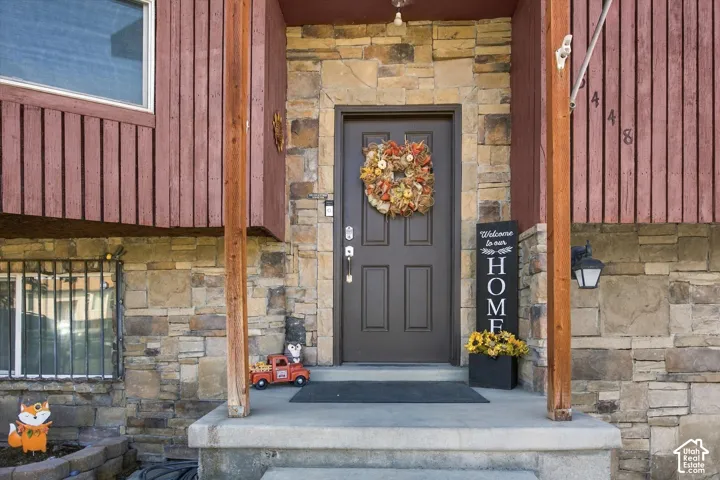 Stone veneer facade with wood siding