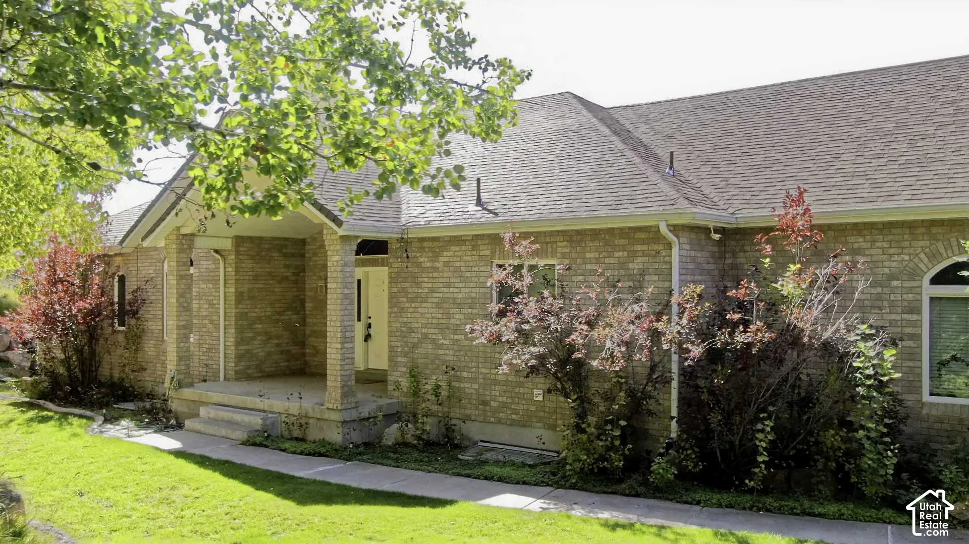 Brick exterior with a covered porch entry