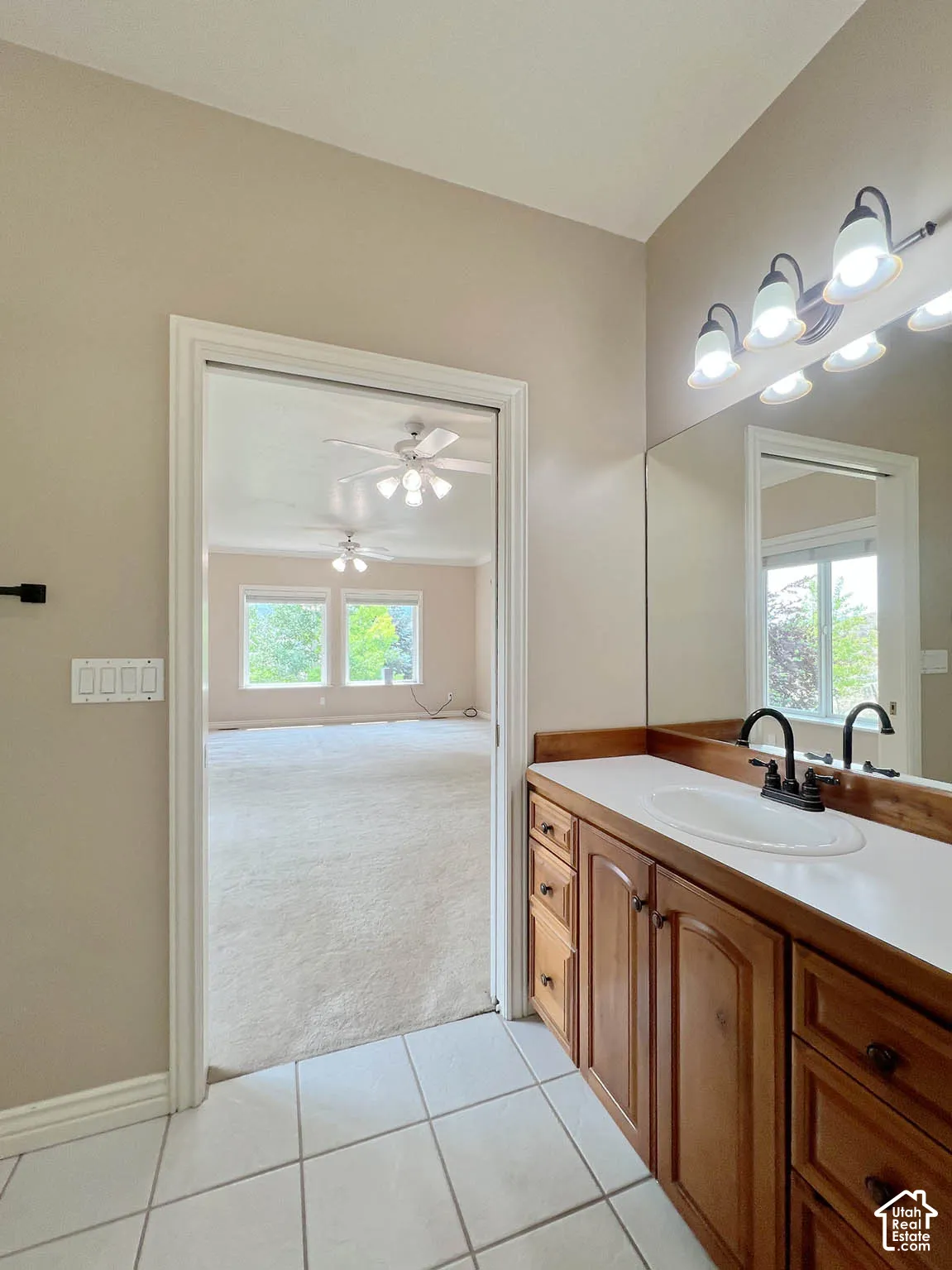 Wood-finish vanity with an integrated sink and countertop