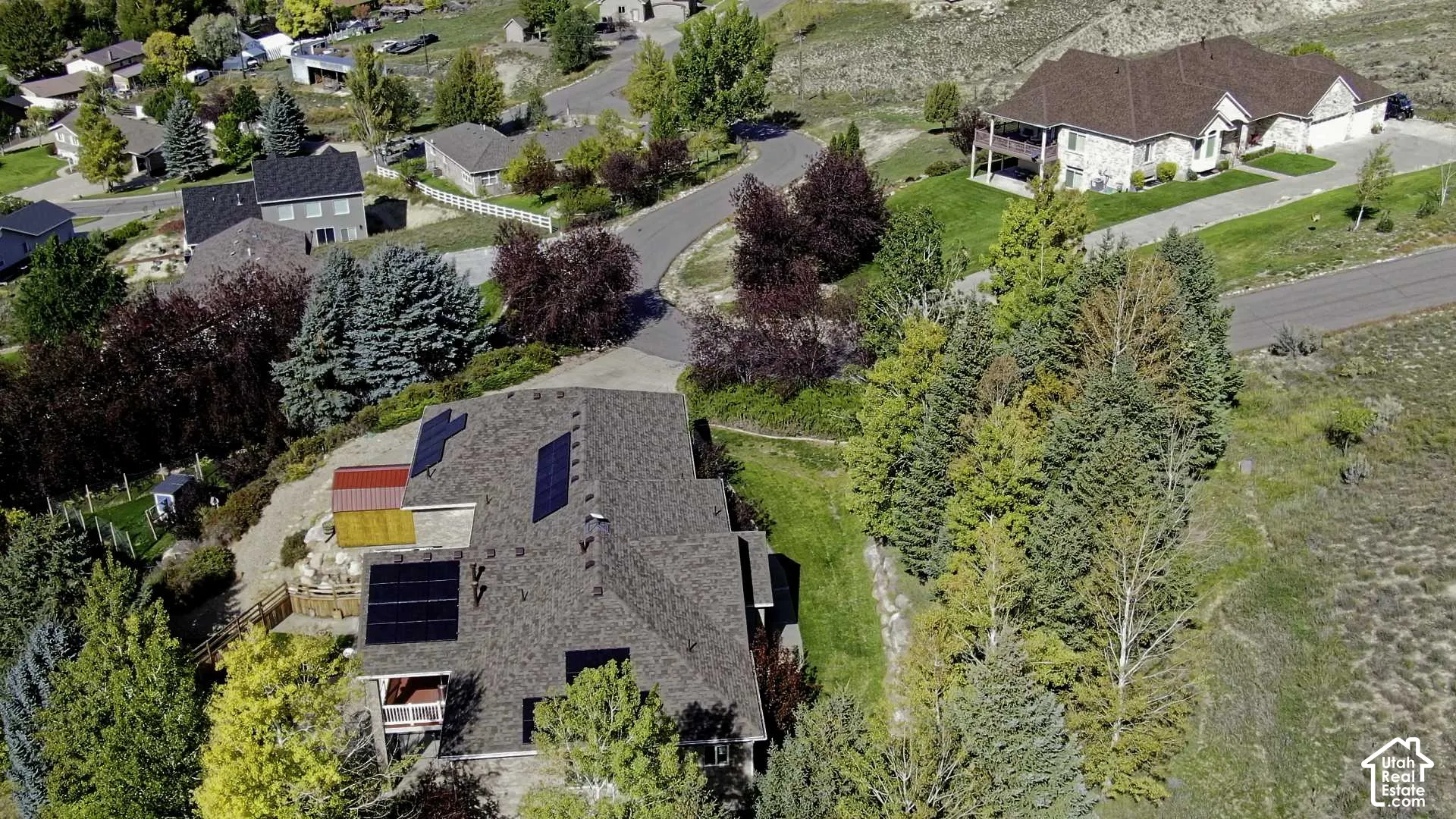 Shingled roof with multiple solar panel arrays