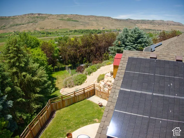 Solar panel array on a shingle roof