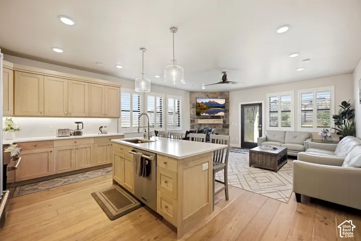 Open-concept living space with wood-finish flooring
