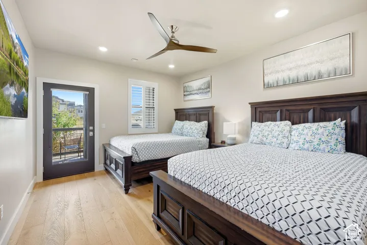 Wood-finish flooring, recessed lighting, and a ceiling fan