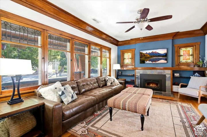 Hardwood flooring complemented by extensive wood trim and crown molding