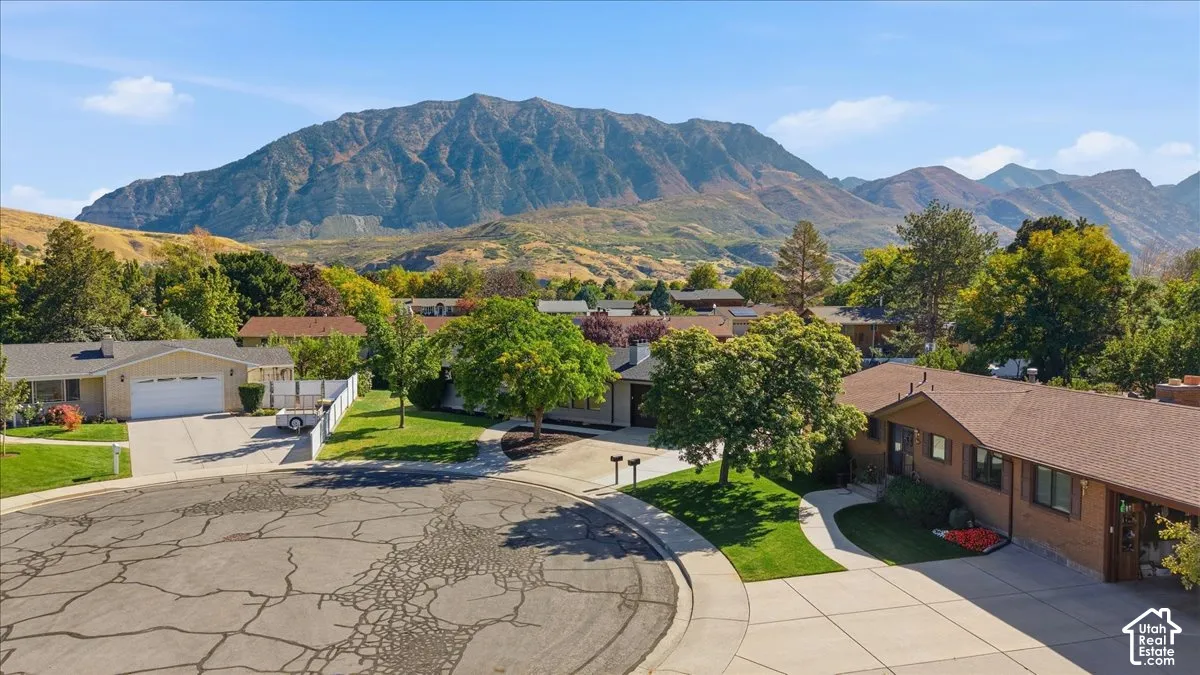 Expansive mountain backdrop with established residential properties