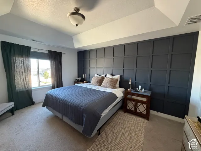 Tray ceiling with a central flush-mount light fixture