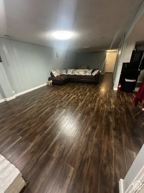 Wood-finish flooring throughout, featuring a recessed ceiling light