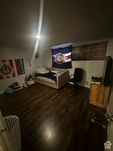 Recessed ceiling lighting illuminates wood-finish flooring