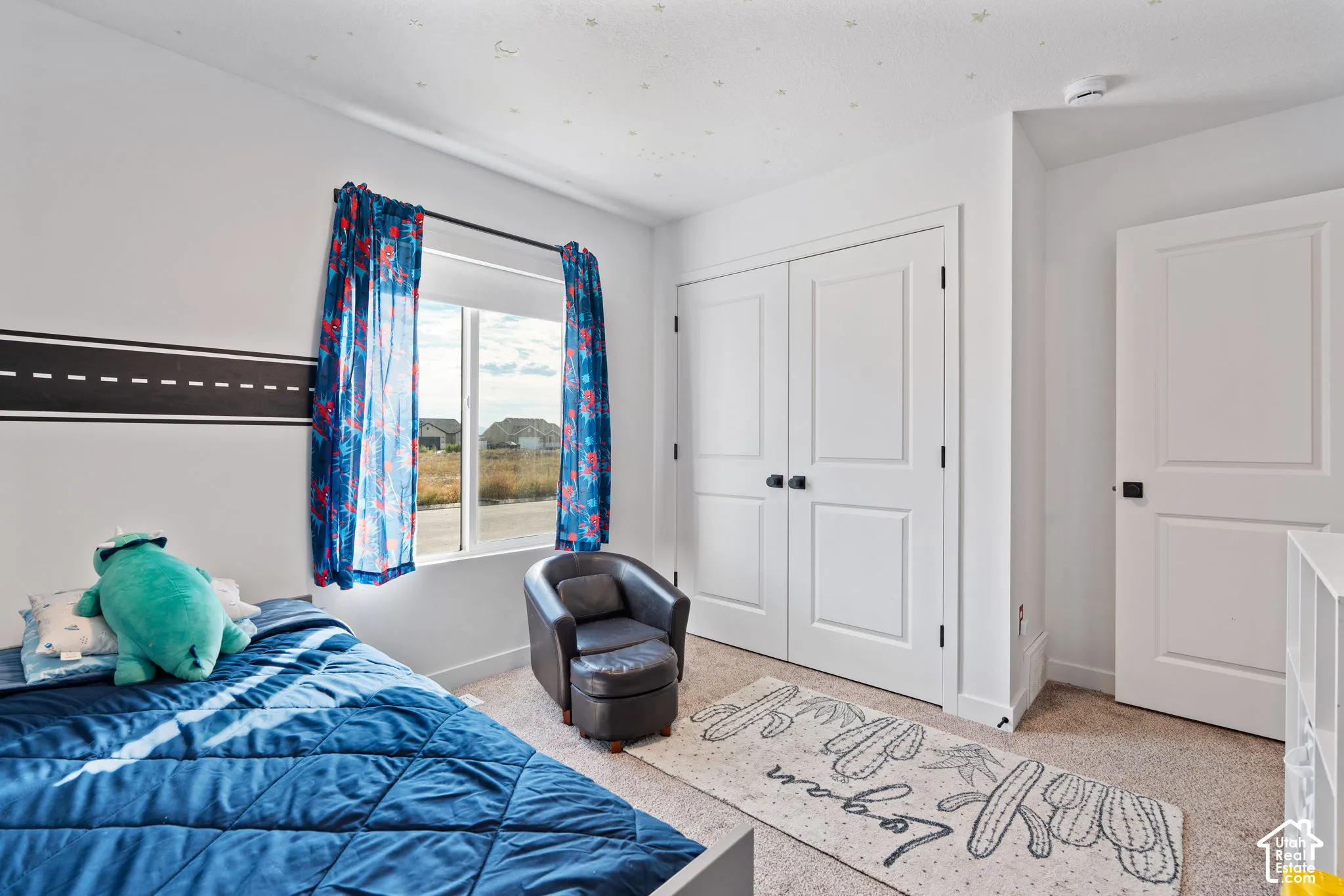 Neutral paint finishes throughout, double-pane window, carpet flooring, and white panel doors