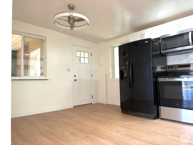 LVP-finish flooring with white baseboards
