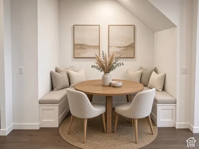 Built-in banquette seating with integrated storage, wood-finish flooring, and recessed overhead lighting