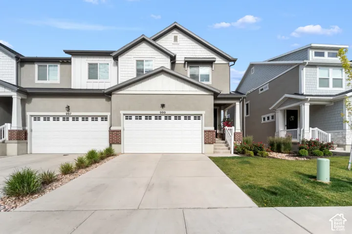 Contemporary exterior with stucco siding and shingle accents