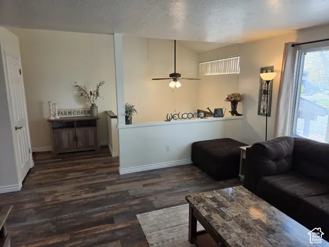 Wood-finish flooring throughout, complemented by a white interior door and baseboards