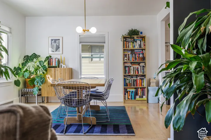 Light wood-finish flooring with white walls