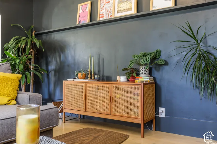 Wall-mounted shelving unit over a dark-toned accent wall