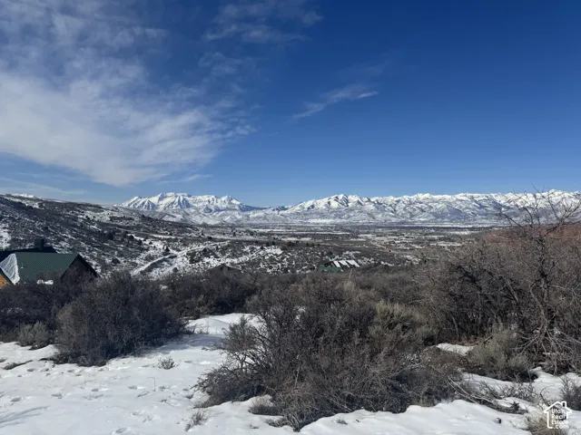 Mountain landscape with snow-covered peaks and extensive natural terrain